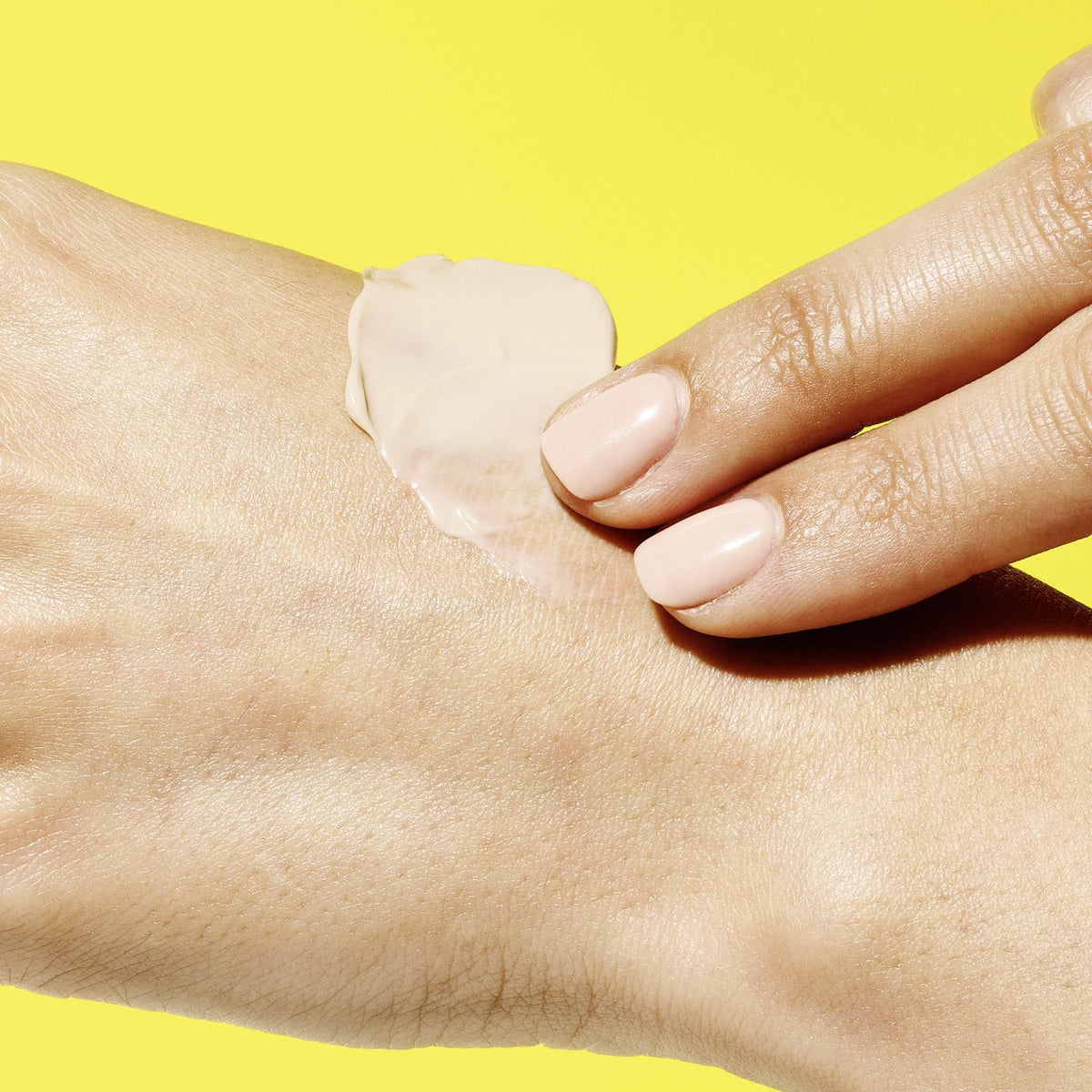 Drunk Elephant tube on bathroom counter, lifestyle shot showing everyday hand care