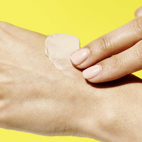 Drunk Elephant tube on bathroom counter, lifestyle shot showing everyday hand care