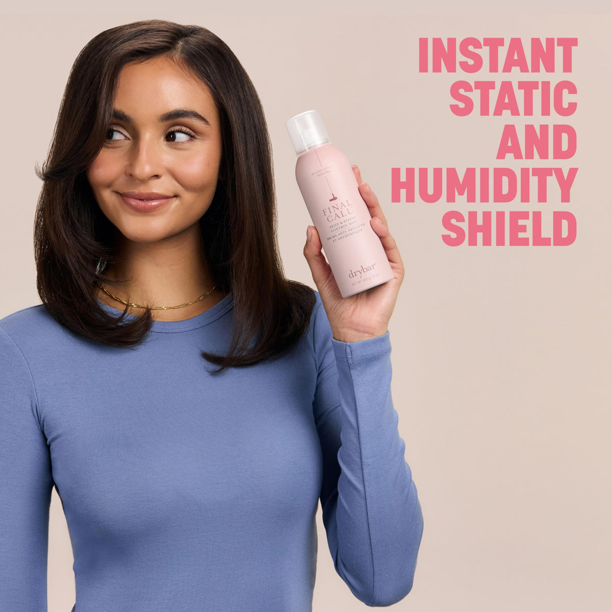 Drybar product sprayed on completed blowout to tame flyaways and frizz