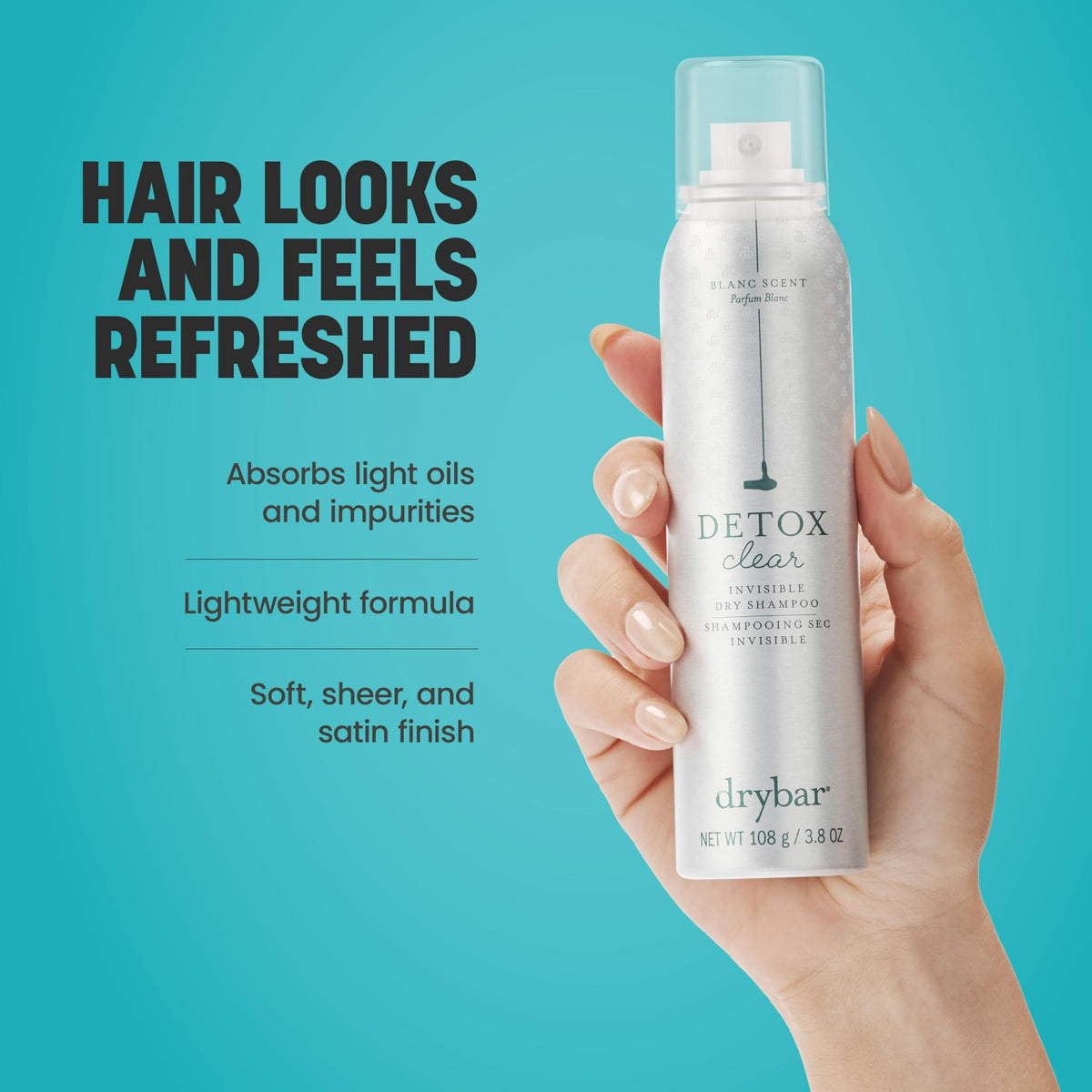 Drybar spray in use at roots demonstrating oil absorption and lift
