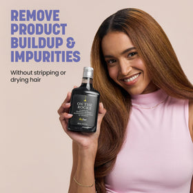 Drybar on the Rocks bottle in hand for scale showing travel-friendly size benefit