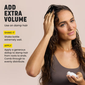 drybar travel size next to passport and toiletry bag indicating on-the-go convenience