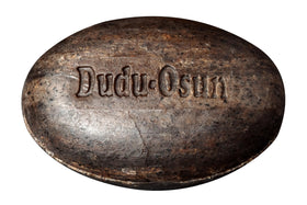Dudu-Osun displayed in bathroom setting suggesting daily use and natural care