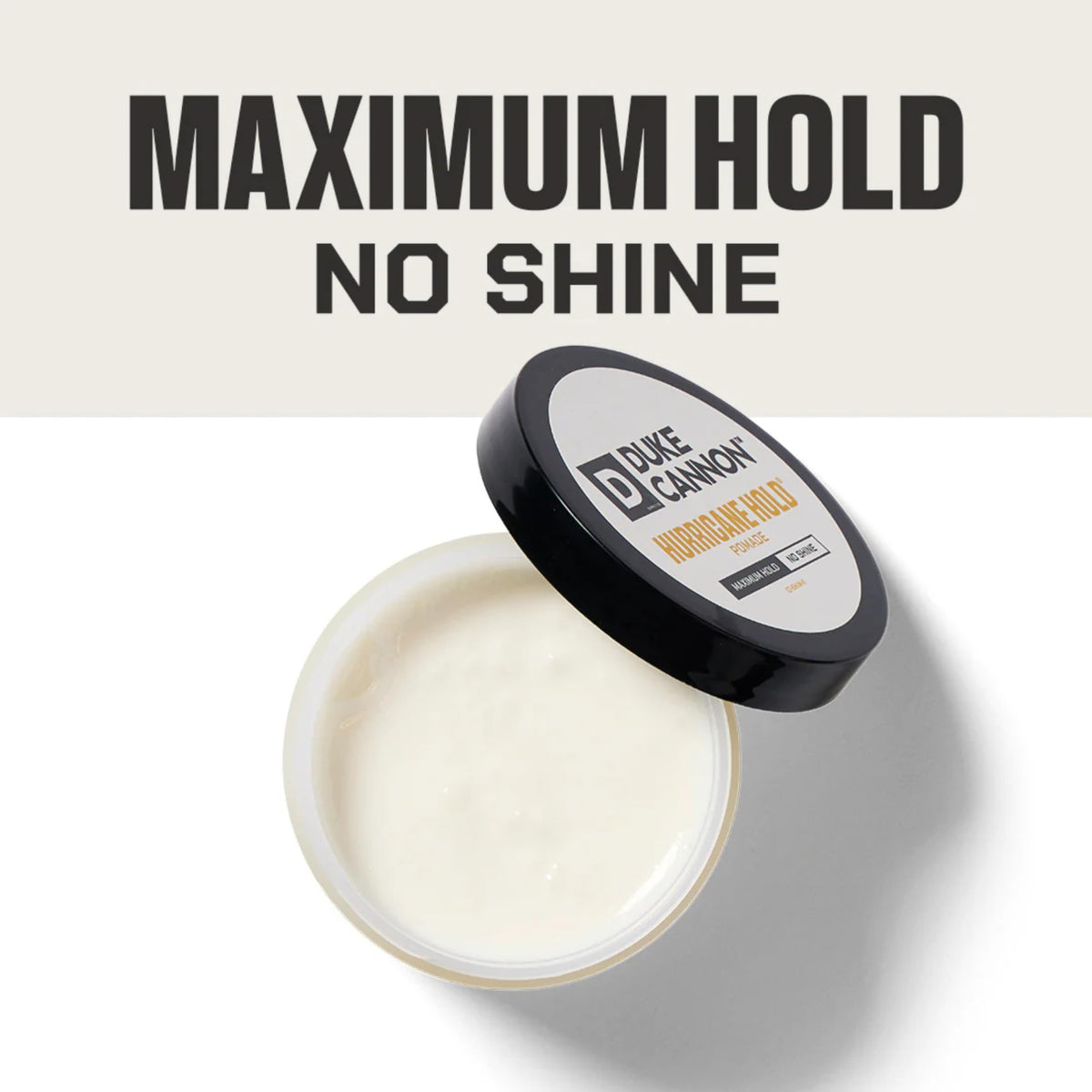 Duke Cannon pomade in palm being warmed for smooth application and control
