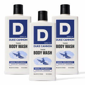 Duke Cannon front packaging showing bold bottle and size benefit