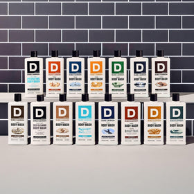 Duke Cannon group shot with bottle and bathroom essentials for lifestyle appeal