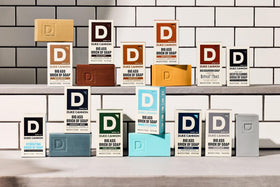 Duke Cannon bars staged in bathroom for rugged aesthetic and shelf-ready appeal