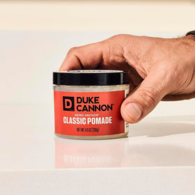 Duke Cannon pomade texture close-up showing creamy consistency and easy spread