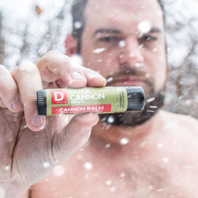 Duke Cannon being applied while hiking, offering sun protection and hydration