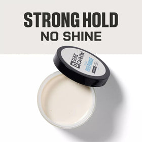 Duke Cannon pomade open close-up showing fibrous matte texture for volume