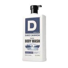 Duke Cannon bottle beside measuring cup showing 30 fl oz size and value
