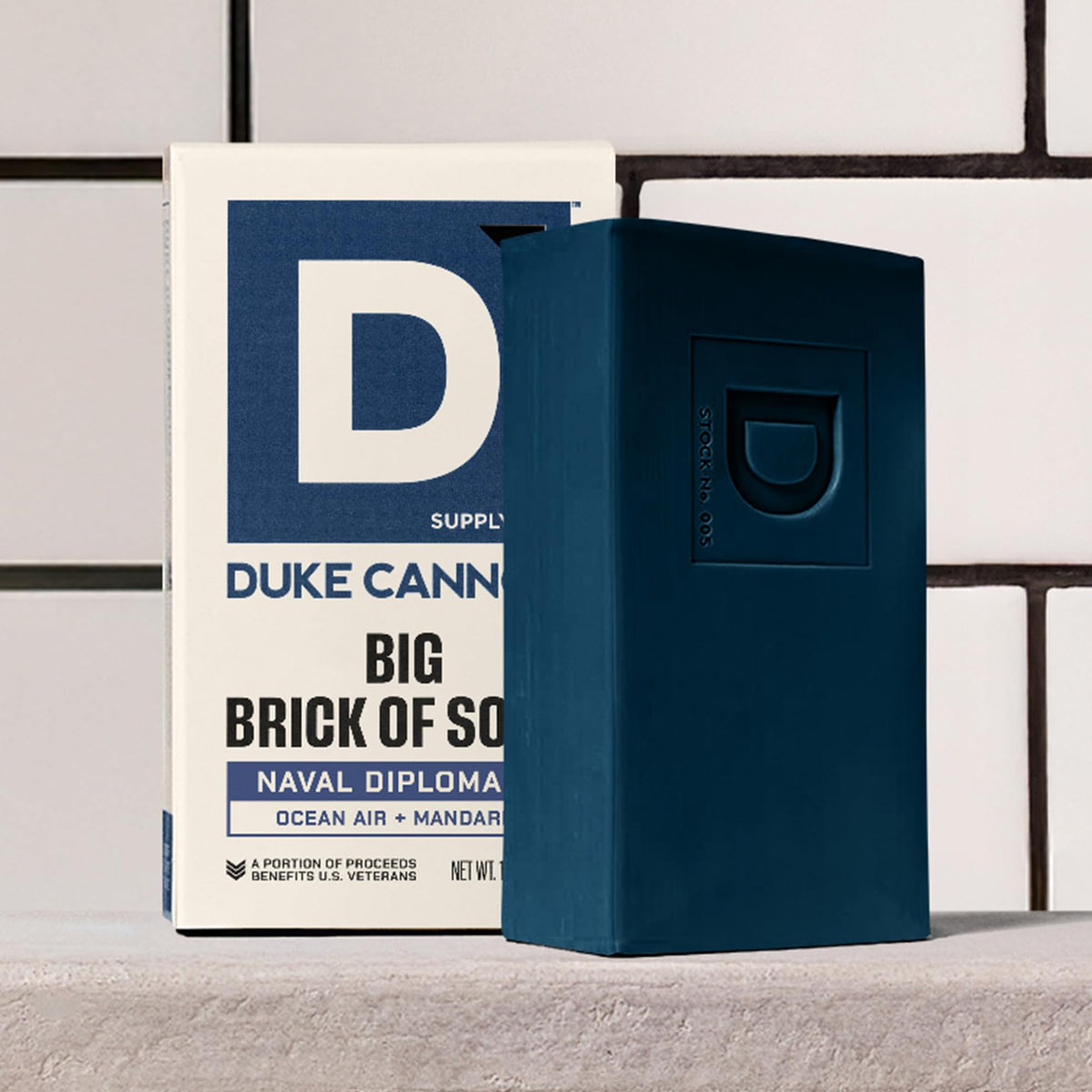 Duke Cannon soap on draining dish keeping bar dry to last longer