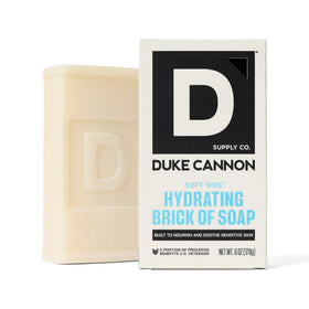Duke Cannon soap displayed with grooming kit emphasizing complementary fragrance benefit