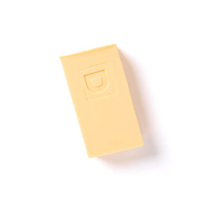 Close-up of triple-milled soap texture on Duke Cannon bar, highlighting long-lasting density