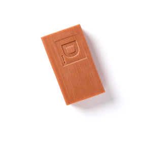 Close-up of Duke Cannon bar texture highlighting triple-milled density and lasting lather benefit