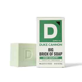 Duke Cannon Wayfinder bar displayed with cedar elements for fresh cedar-citrus benefit