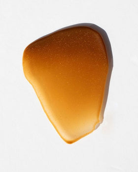 DUNE Golden Guard lotion texture swirl demonstrating fast absorption benefit