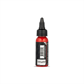 Dynamic Color Co pure red close texture drop displaying pigment flow and smooth consistency