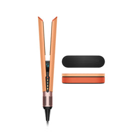 Dyson Airstrait front view showing Ceramic Apricot and Topaz finish, highlighting style