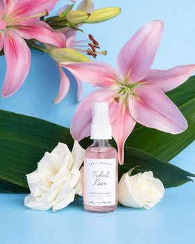 Earth Harbor bottle next to hand showing size and travel-ready