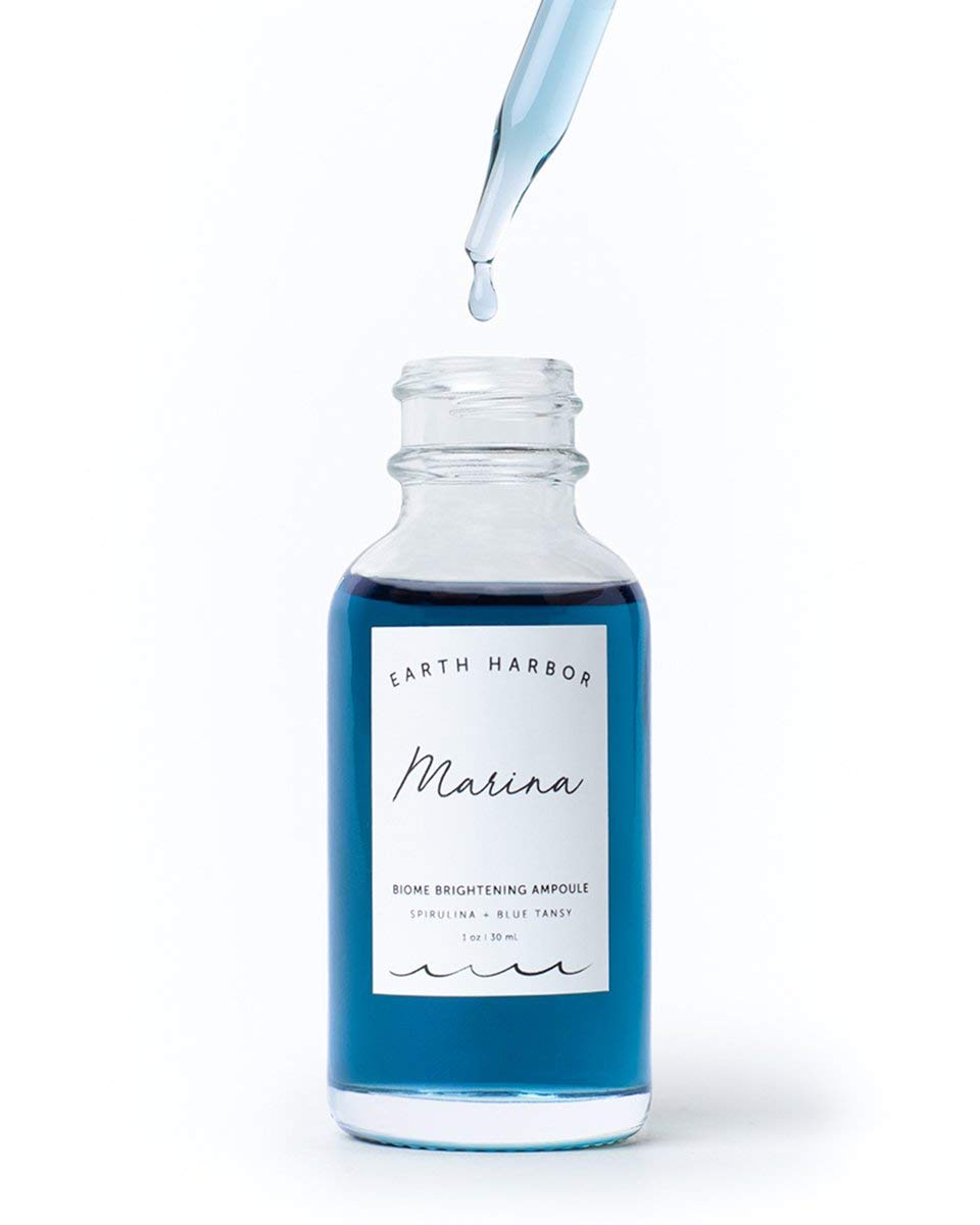 Earth Harbor MARINA dropper dispensing serum, demonstrating easy precise application