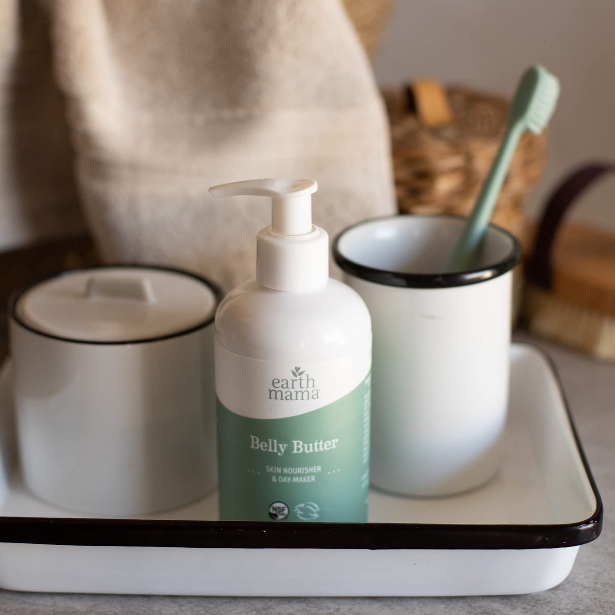 Bathroom shelf with Earth Mama Belly Butter demonstrating everyday skincare use