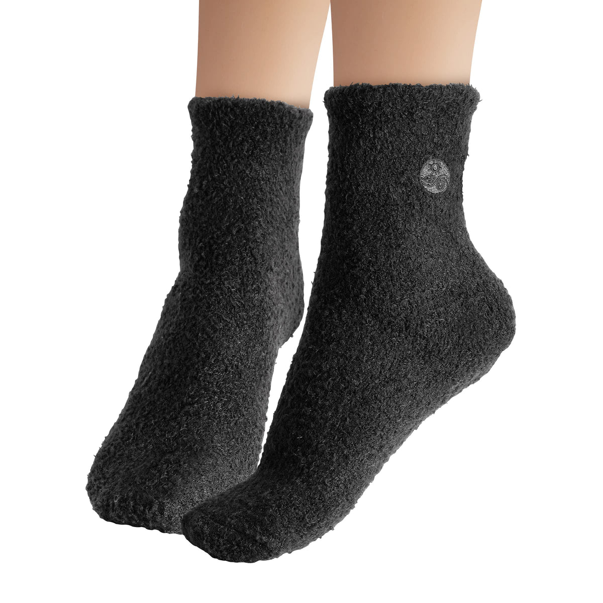 Earth Therapeutics aloe socks with foot lotion illustrating prep for use