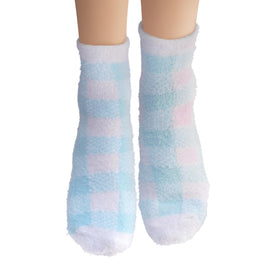 Earth Therapeutics socks beside a ruler showing one-size-fit convenience