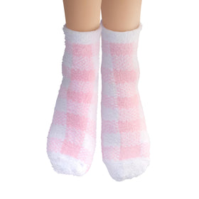 Earth Therapeutics socks worn during foot treatment demonstrating locked-in hydration benefit