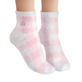 Earth Therapeutics socks held next to ruler showing fit and scale for most foot sizes