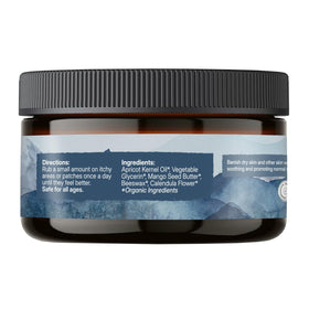 Earthley Wellness calendula flowers next to balm highlighting soothing botanicals