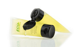 ECO Amenities size comparison in hand showing 1oz travel-friendly scale benefit