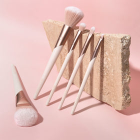 EcoTools limited-edition packaging open to show brushes and sustainable presentation benefit
