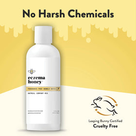 ECZEMA HONEY 12 oz bottle next to hand to show compact travel-friendly size benefit