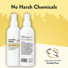 ECZEMA HONEY 8 fl oz bottle next to hand to show true size and portability