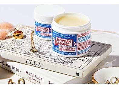 Egyptian Magic jar tucked into travel pouch for on-the-go skin care