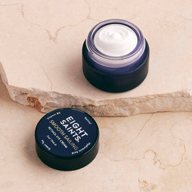 Eight Saints jar with box in lifestyle setting indicating travel-friendly 0.5 oz size