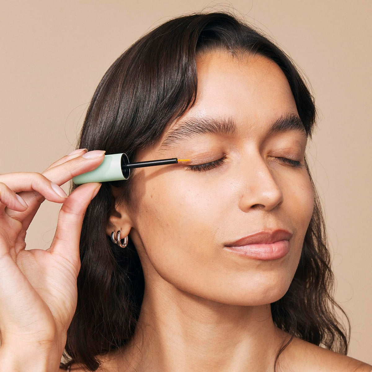 Eight Saints serum texture on fingertip showing lightweight hydration benefit