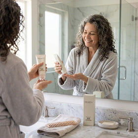 Elabore Hearty Perfect being applied to hair for frizz control and shine