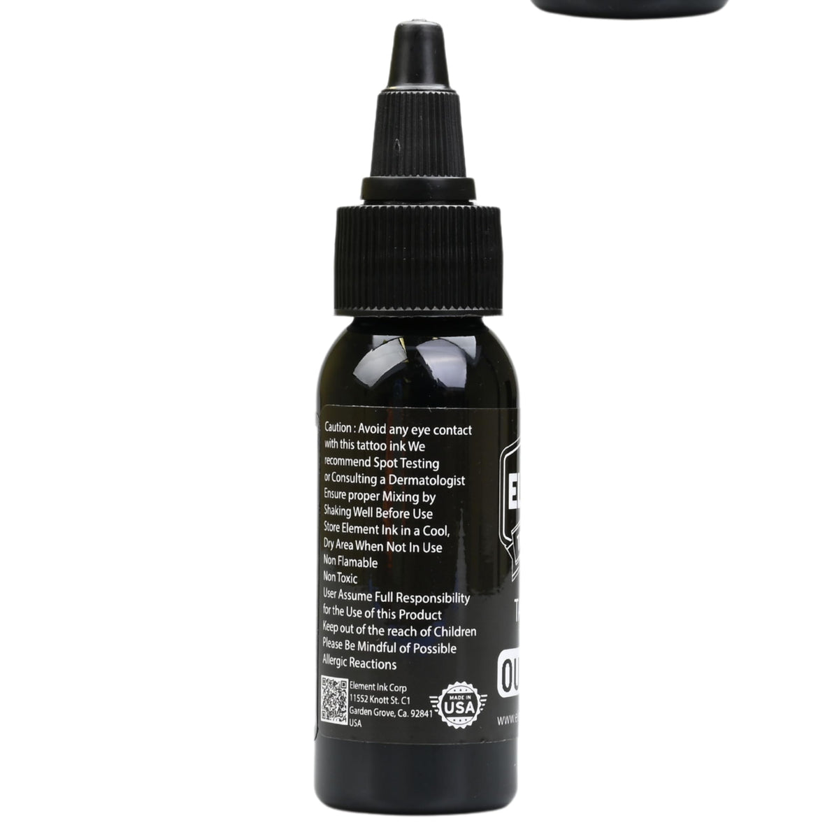 Element Tattoo Supply bottle on workstation conveying professional use and tidy setup