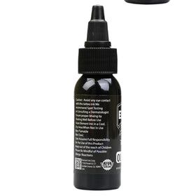 Element Tattoo Supply bottle on workstation conveying professional use and tidy setup