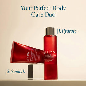 ELEMIS 100 mL bottle next to a hand for accurate size comparison