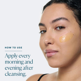 ELEMIS bottle staged with moisturizer and sunscreen for layered routine benefit