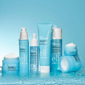 e.l.f. moisturizer being applied from jar to fingertips, showing easy layering under makeup