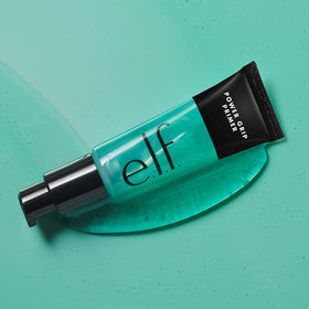 e.l.f. Power Grip next to a ruler showing 0.811 fl oz size for scale and travel convenience