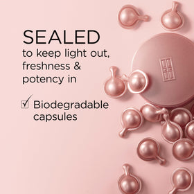 Elizabeth Arden capsules next to small spoon showing product size and control