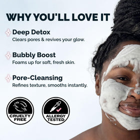 Hand holding foamy carbonated bubbles from Elizabeth Mott mask showing gentle cleansing action
