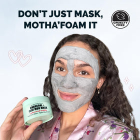 Close-up of the mask's creamy texture highlighting kaolin clay and charcoal particles