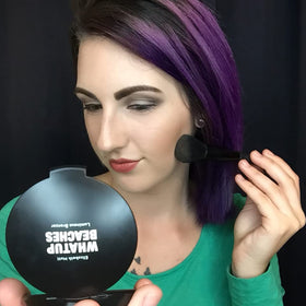 Elizabeth Mott brush applying bronzer for effortless contouring and warming