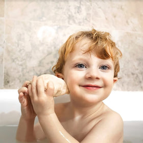 ELLAOLA sachet beside a small bath toy showing single-use scale and convenience